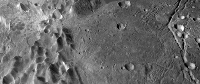 Mountain ridges and volcanic plains on Pluto’s moon, Charon.